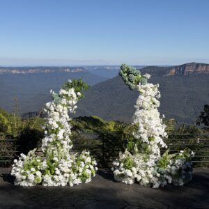 birthday backdrop hire setup with faux flowers in Sydney